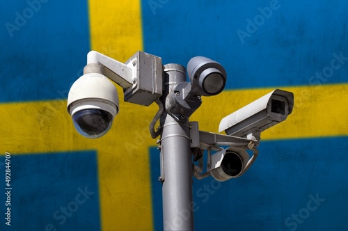 Closed circuit camera Multi-angle CCTV system against the background of the national flag of Sweden.