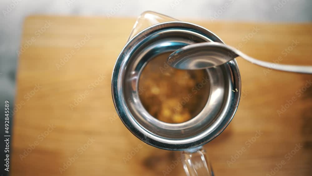 Tea Boiling Process herbal tea. tea drink. preparation of herbal tea. close-up. top view ...