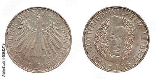 5 Deutsche Mark coin of the Federal Republic of Germany with the cote of arm eagle and a portrait of the German philosopher, mathematician, jurist, historian Gottfried Wilhelm Leibniz.