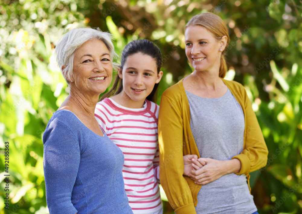 The girls are out in the park. Shot of three generations of family women standing outdoors. The girls are out in the park. Shot of three generations of family women standing outdoors.
