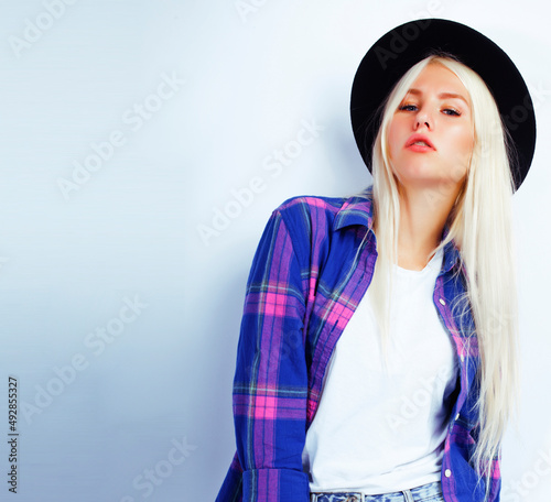 young pretty stylish blond hipster girl in hat posing emotional isolated on white background, lifestyle people concept © iordani