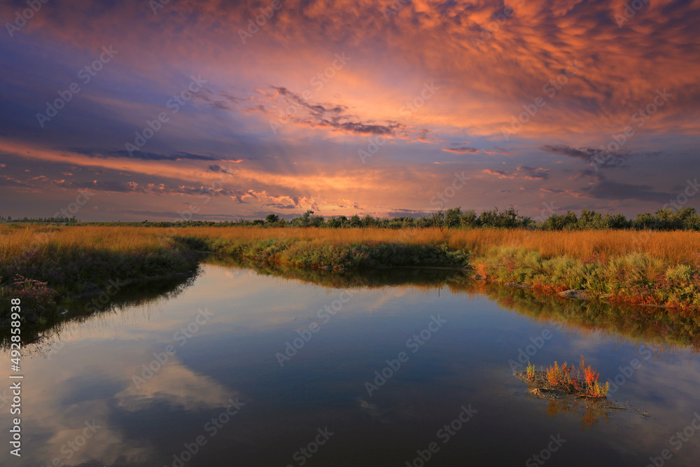 Naklejka premium sunset over lake