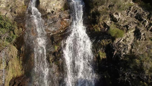 Beautiful waterfall in Cascata da Ribeira das Quelhas, located near Lousa, Portugal photo