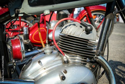 The detail of the polished old motorbike with the two stroke engine. The head has ribbing and is air cooled.  © shootingtheworld