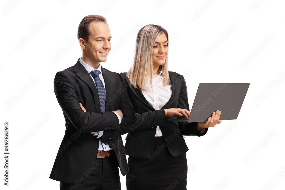 Businessman and businesswoman working on a laptop computer Businessman and businesswoman working on a laptop computer
