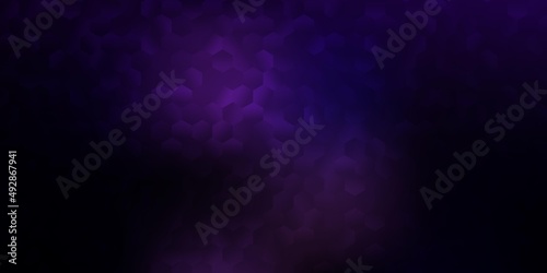 Dark purple vector texture with colorful hexagons.