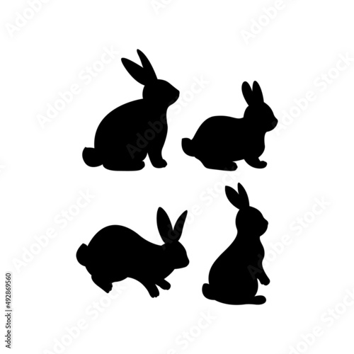 Set of black silhouettes of Easter bunnies. Cute hand drawn vector illustration. Isolated white background. For Easter decor, scrapbooks, invitations and cards