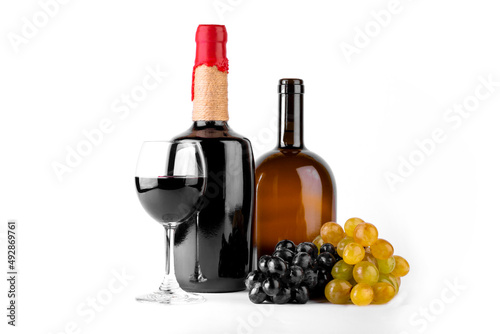 Red and white wine bottle with wine glasses and grapes on white background.