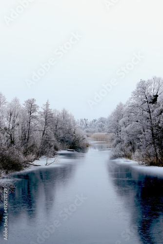 Ice river in winter forest