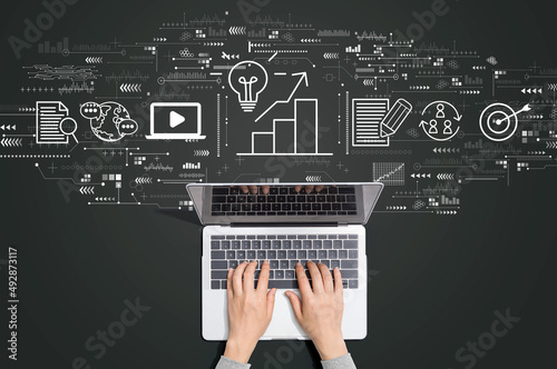 Content marketing concept with person using a laptop computer