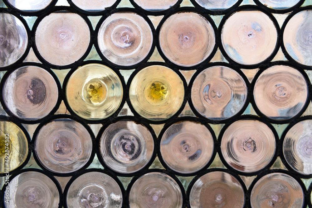 Stained glass window in a medieval castle. Round glass pattern. Stained glass window in a medieval castle. Round glass pattern.