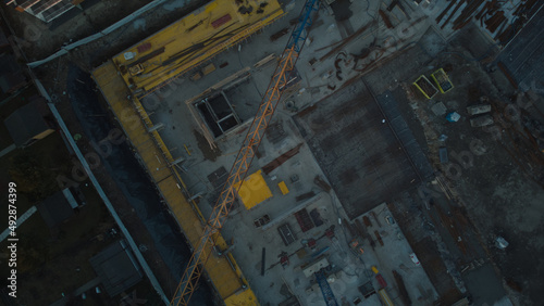 Aerial drone top down view on residential construction site in the city at end of the day