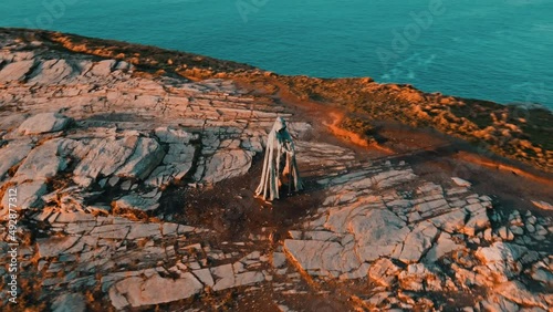 Aerial view around the Monument to King Arthur in Britain.Monument close up on sea background .