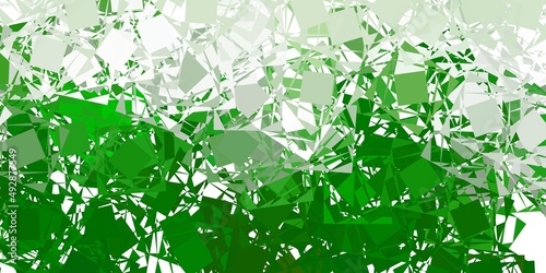 Light green vector background with polygonal forms.