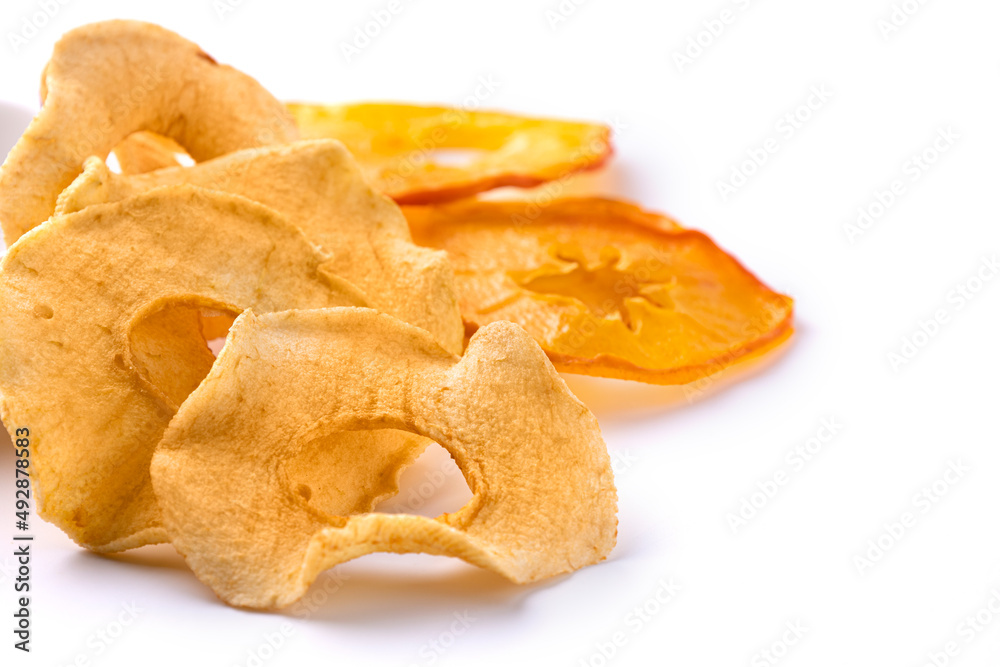 Dried apples and persimmons on a white background Dried apples and persimmons on a white background