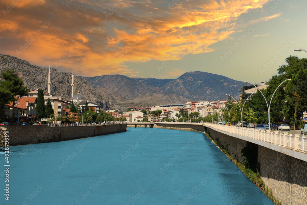 Fascinating view of the city of Amasya, also known as the city of princes. wonderful clouds coming out of the mountains. YESILIRMAK river.