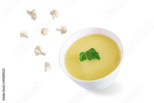 Potato cauliflower puree soup in a bowl on a white isolated background