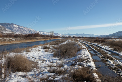 Riverside trail in the mountains on a winter day © Lynda