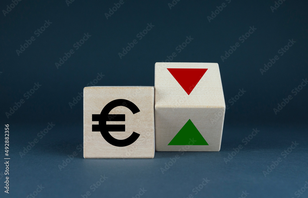 Cubes form Euro sign and up and down arrows. Finance and business concept Cubes form Euro sign and up and down arrows. Finance and business concept