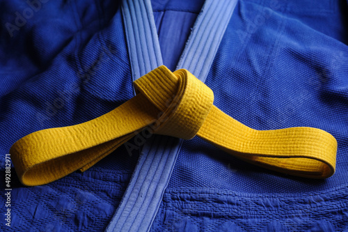 Yellow judo belt on a blue kimono. Colors of the Ukrainian flag