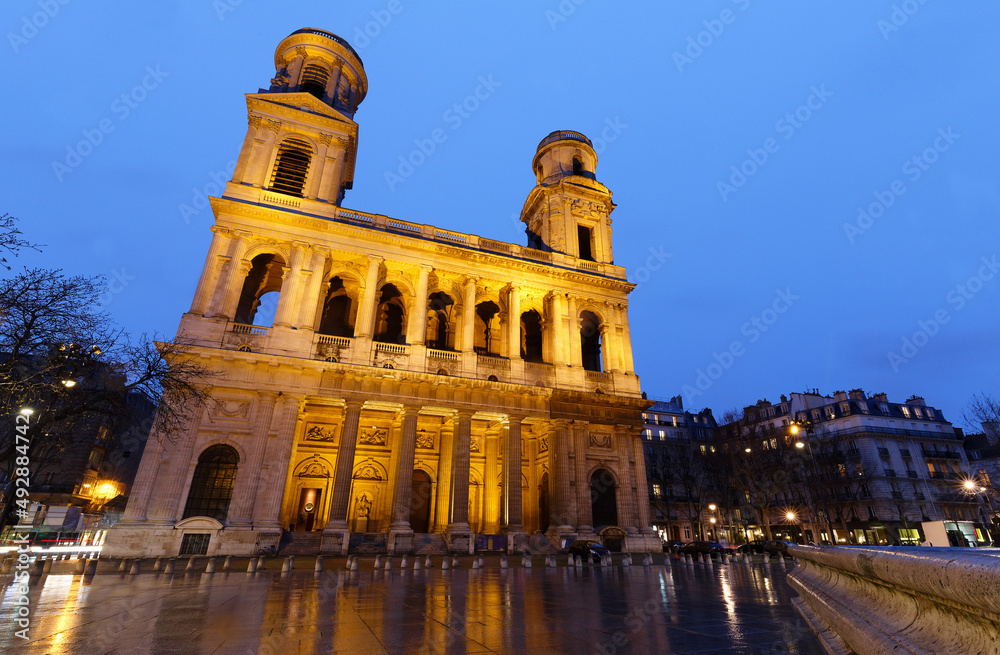 The famous church of Saint Sulpice at rainy night , Paris, France.