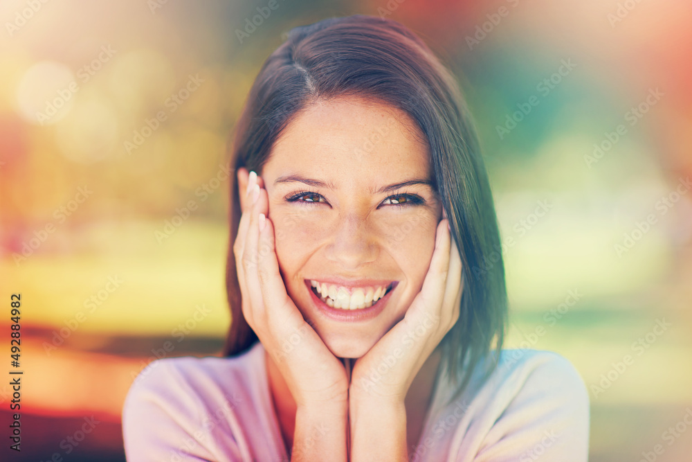 Sunny days and smiles. Portrait of a beautiful young woman enjoying a day at the park. Sunny days and smiles. Portrait of a beautiful young woman enjoying a day at the park.
