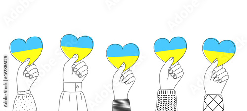 Support Ukraine. Five hands holding blue and yellow hearts. Concept border. photo