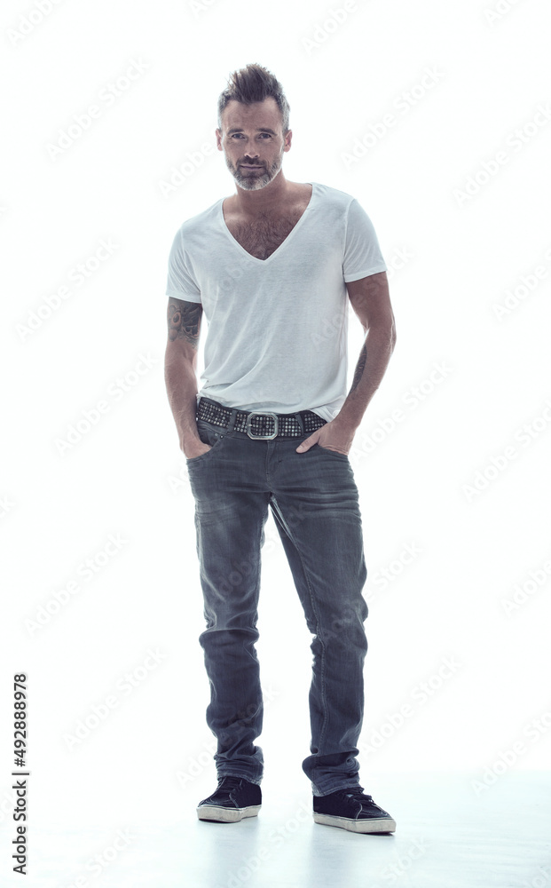 Ill be a rebel till I die. A mature bearded man with tattoos standing against a white background. Ill be a rebel till I die. A mature bearded man with tattoos standing against a white background.