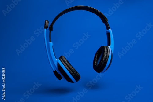 blue headphones on blue background 