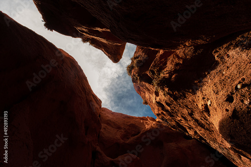 Red rock formation with hollow above in Salta  Argentina