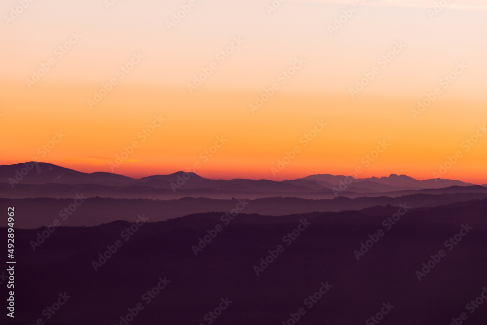 Sunset Above Layers Of Mountains In Fog Sunset Above Layers Of Mountains In Fog