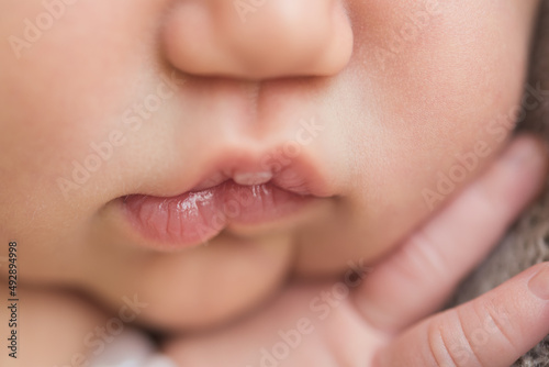 Macro shot of a newborn baby's lips photo