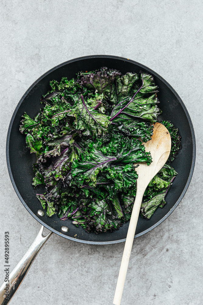 Sauteed kale in a frying pan Stock Photo Adobe Stock