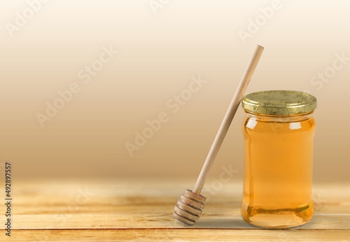 Honey jars, cups and dippers set on the desk