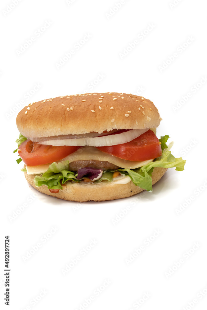 A hamburger, with the ingredients, lettuce, cabbage, cucumber, tomato, onion, cheese, ketchup, mayonnaise. Isolated on white background. One of the most consumed snacks in the world. A hamburger, with the ingredients, lettuce, cabbage, cucumber, tomato, onion, cheese, ketchup, mayonnaise. Isolated on white background. One of the most consumed snacks in the world.
