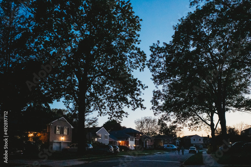 A suburban street at dusk. photo