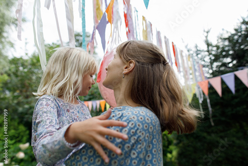 Mother and daughter in the garden photo