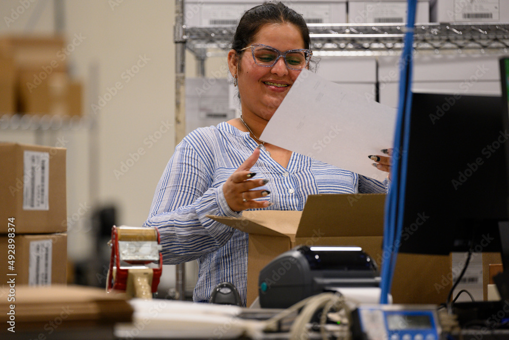 Portrait of Laughing Employee at Warehouse workplace 