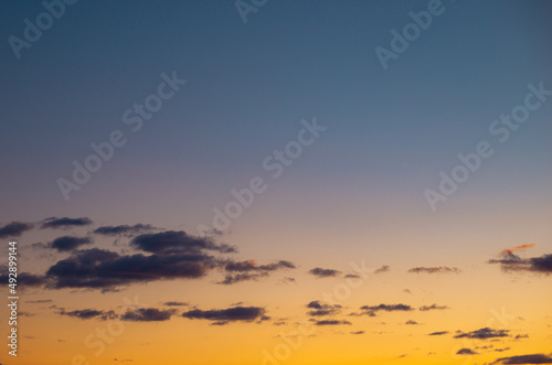 Yellow and blue colors of Ukraine sky. Beautiful peaceful sunset  landscape. © Viktoriia