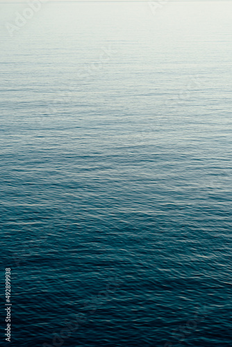 Minimal composition of clear blue sea photo