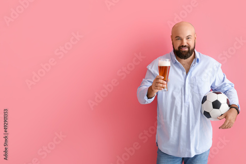 Bald man with beer and socc...