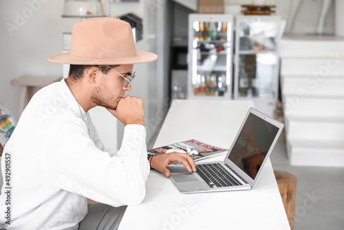Handsome young man working ...