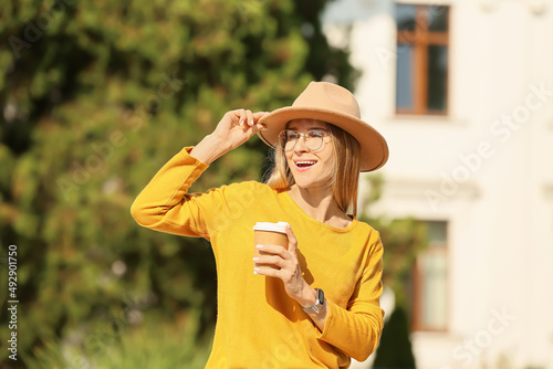 Beautiful woman with cup of...