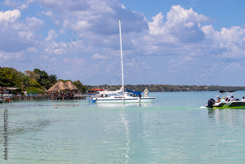 boats in the bay from bacalar's lagoon