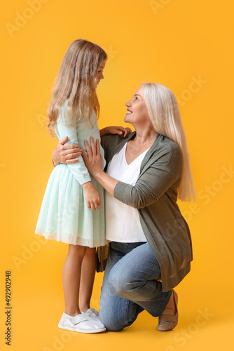 Mature woman with her littl...