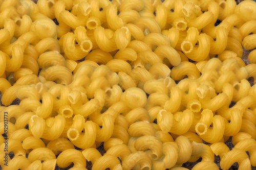 Dry pasta. Macaroni pasta. Diet and food concept.