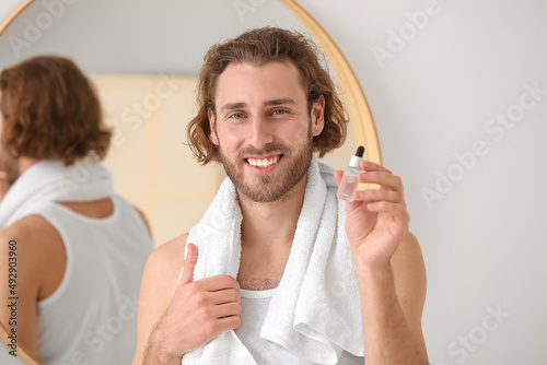 Young man with serum for sk...