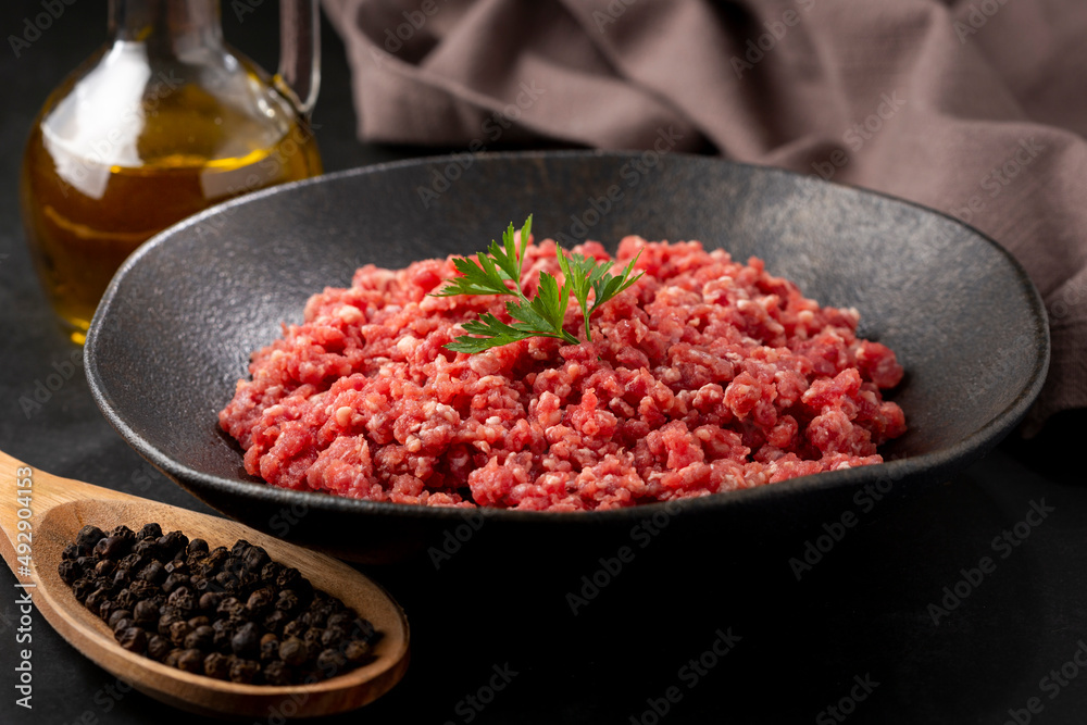 Raw ground beef ready for preparation. Raw ground beef ready for preparation.