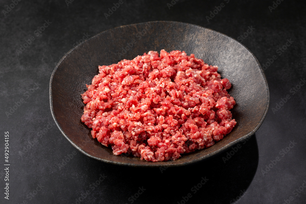 Raw ground beef ready for preparation. Raw ground beef ready for preparation.