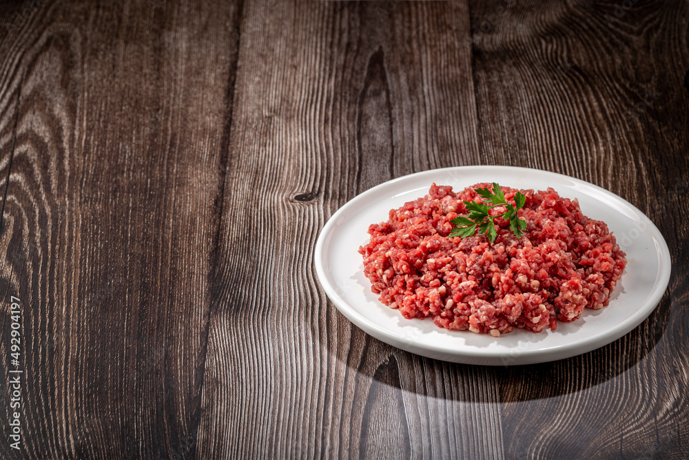 Raw ground beef ready for preparation. Raw ground beef ready for preparation.